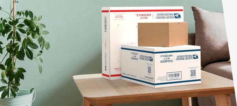 Domestic mail and shipping 十大网堵平台 product boxes sitting on a table.